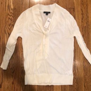 Cream colored tie neck sweater